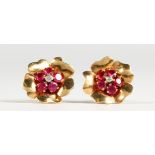 A PAIR OF MEGAN PROMIS BREVETTE GOLD, DIAMOND AND RUBY EARRINGS, in a BOUCHERON FITTED CASE.