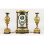 A GOOD FRENCH CHAMPLEVE ENAMEL AND ONYX THREE PIECE CLOCK GARNITURE. Clock: 12ins high. Side Pieces: