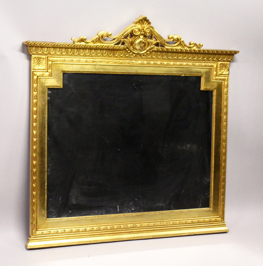 A GILT FRAMED OVER MANTLE MIRROR. 4’6” H x 4’7” W