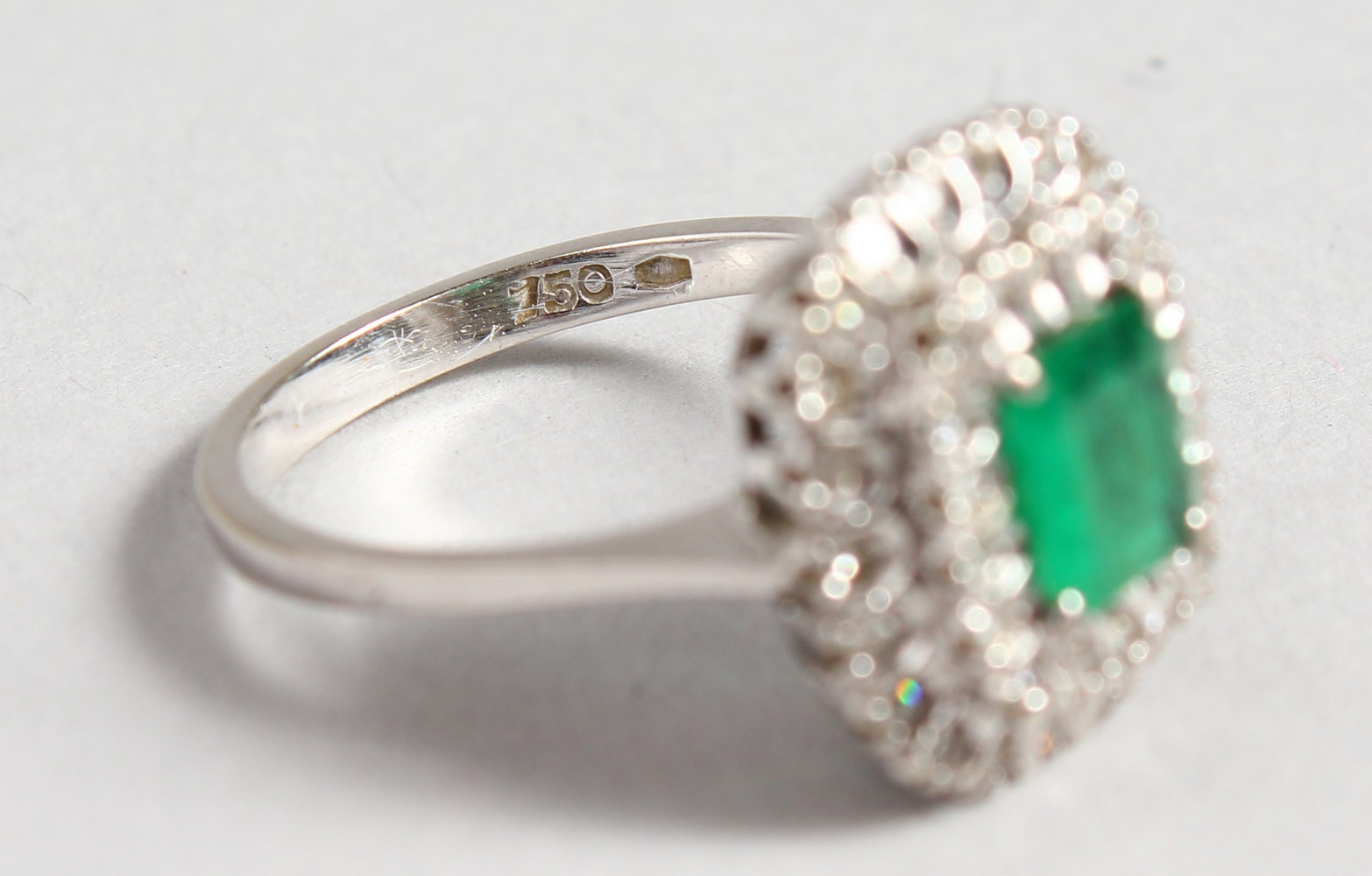 AN 18CT WHITE GOLD, DIAMOND AND EMERALD CLUSTER RING. - Image 3 of 3