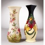 TWO MOORCROFT POTTERY VASES. 8ins and 8.5ins high.