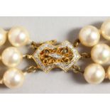 A GOOD TRIPLE-ROW PEARL NECKLACE, with 14CT GOLD CLASP.