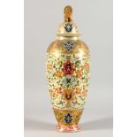 A HUNGARIAN PORCELAIN VASE AND COVER, in the Oriental/Islamic taste. 17ins high.