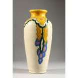 A BELGIUM POTTERY VASE, with incised and painted decoration. 12ins high.