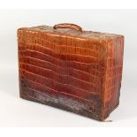 A CROCODILE SUITCASE. 20ins long.