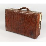 A CROCODILE SUITCASE. 23ins long.