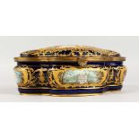 A SUPERB CONTINENTAL SHAPED CASKET AND COVER, rich dark blue ground with gold decoration, the lid