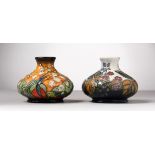 TWO BULBOUS MOORCROFT POTTERY VASES. 2000. No. 82/500. 5ins diameter x 4.5ins high.