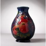 A MOORCROFT POTTERY BULBOUS VASE, "Pomegranates and Birds". Impressed MOORCROFT. WM. 7.5ins high.