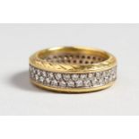 A HEAVY 18CT GOLD AND DIAMOND FULL ETERNITY RING.