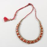 A SUPERB RUBY AND DIAMOND NECKLACE, set with seventeen diamonds surrounded by rubies, backed with