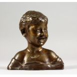 A SMALL BRONZE BUST OF A LAUGHING BOY. 6ins high.