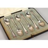 A SET OF SIX SILVER COFFEE SPOONS, cased. Walker & Hall, Sheffield 1934.