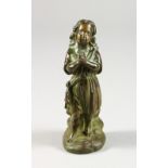 A SMALL CAST BRONZE FIGURE OF A YOUNG GIRL PRAYING. 6ins high.