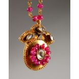 A GOOD VICTORIAN 18CT GOLD, RUBY AND DIAMOND PENDANT ON CHAIN, in original leather box.