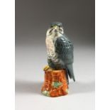 A PEREGRINE FALCON PORCELAIN FIGURE FOR BENEAGLES WHISKY, 200ml. 7ins high.