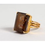AN 18CT GOLD LARGE TOPAZ RING.
