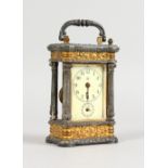 A SMALL CONTINENTAL CARRIAGE CLOCK, with ormolu and cast metal case, porcelain dial striking on a