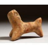 A SMALL TERRACOTTA MODEL OF A DOG.