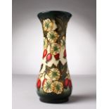 A MOORCROFT POTTERY VASE, "Rosehips". Signed N. Stanley, Made for Liberty, No. 142/400. 8ins high.