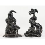 TWO CAST IRON DOORSTOPS, Mr Punch and a classical dolphin. 12.5ins and 13.5ins high.