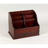 A 19TH CENTURY MAHOGANY DESK STAND, with small drawers and open compartments. 12ins wide x 9ins high