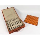 A GOOD LEATHER CASED CHESS SET.