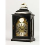 A SUPERB BRACKET CLOCK by SIMON DE CHARMERS, LONDON, in an ebony case with brass carrying handle,