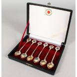 A SET OF SIX TOKYO SILVER SPOONS, cased.