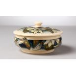 A MOORCROFT POTTERY CIRCULAR POWDER BOWL AND COVER, 2000. 5ins diameter.