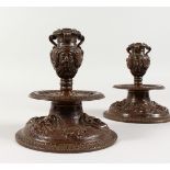 A GOOD PAIR OF ORNATE RENAISSANCE STYLE BRONZE CANDLESTICKS. 6ins high.