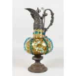 A WMF NEO CLASSICAL STYLE CLARET JUG, with ornate metal mounts and floral painted amber coloured