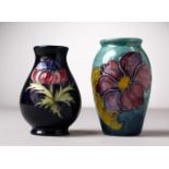 TWO SMALL MOORCROFT POTTERY VASES. 4ins and 4.5ins high.
