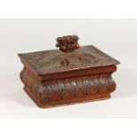 A WOODEN BOX AND COVER, with well carved anthemion leaf decoration. 8.75ins wide.