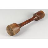 A LARGE LIGNUM VITAE DOUBLE ENDED PESTLE. 20ins long.