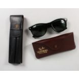 A GUCCI LEATHER CIGAR CASE and A RAY-BAN SUNGLASSES CASE, with sunglasses. Sunglasses are not marked