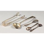 A SMALL PAIR OF SUGAR TONGS, London 1902, mustard spoon and three salt spoons.