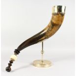 ANTHONY REDMILE (Born 1937) CREATIVE DESIGNER A SIGNED HORN ON STAND. 17ins long.