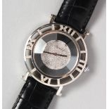 AN 18CT WHITE GOLD ROMUS DIAMOND SET WATCH, with leather strap. Inscribed Maussaiff, in an Austin