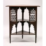 A SMALL MAHOGANY FREESTANDING CORNER SHELF, in the Liberty/Eastern style, with two shelves and
