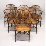 A SET OF SIX 19TH CENTURY YEW AND ELM WINDSOR ARMCHAIRS, with pierced back splats, and crinoline