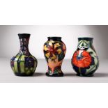 THREE SMALL VARIOUS MOORCROFT VASES. 4ins high.