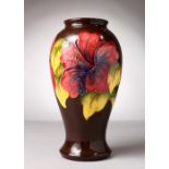 A GOOD MOORCROFT POTTERY VASE, "Hibiscus". No. 75 of 200. Dated 1982. 10.5ins diameter.