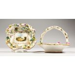 A SMALL PAIR OF ROCKINGHAM FLOWER ENCRUSTED BASKETS, the centres painted with a house. Griffin
