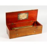 A GOOD SWISS MUSICAL BOX, in a plain case playing six airs. 15.5ins long.