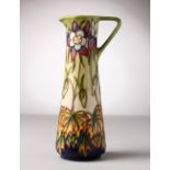 A MOORCROFT POTTERY TALL JUG. Initial R. No. 150/250. 9.5ins high.