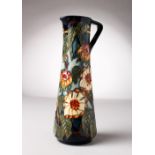 A MOORCROFT POTTERY TALL JUG. Signed K. Goodman. No. 355/400. 9.5ins high.