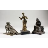 THREE SMALL CAST METAL GROUPS; a couple on a sledge, a clog maker and a standing female.