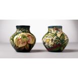 TWO SMALL MOORCROFT POTTERY BULBOUS VASES. 3.5ins high.