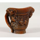 A CHINESE CARVED HORN LIBATION CUP. 4.5ins high.